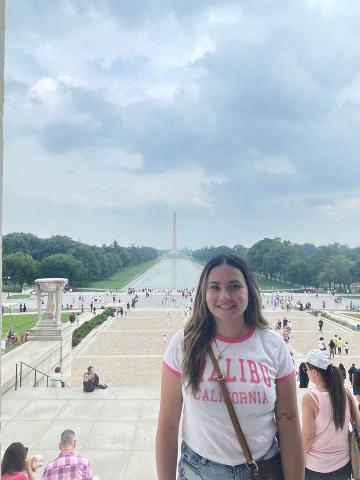 Intern Jacqueline standing on the steps of the Lincoln Memorial.