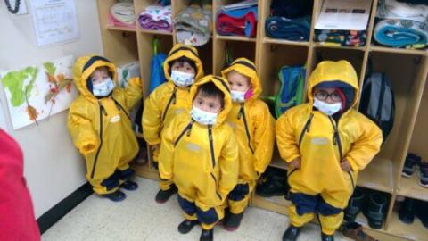 Kids wearing raincoats.